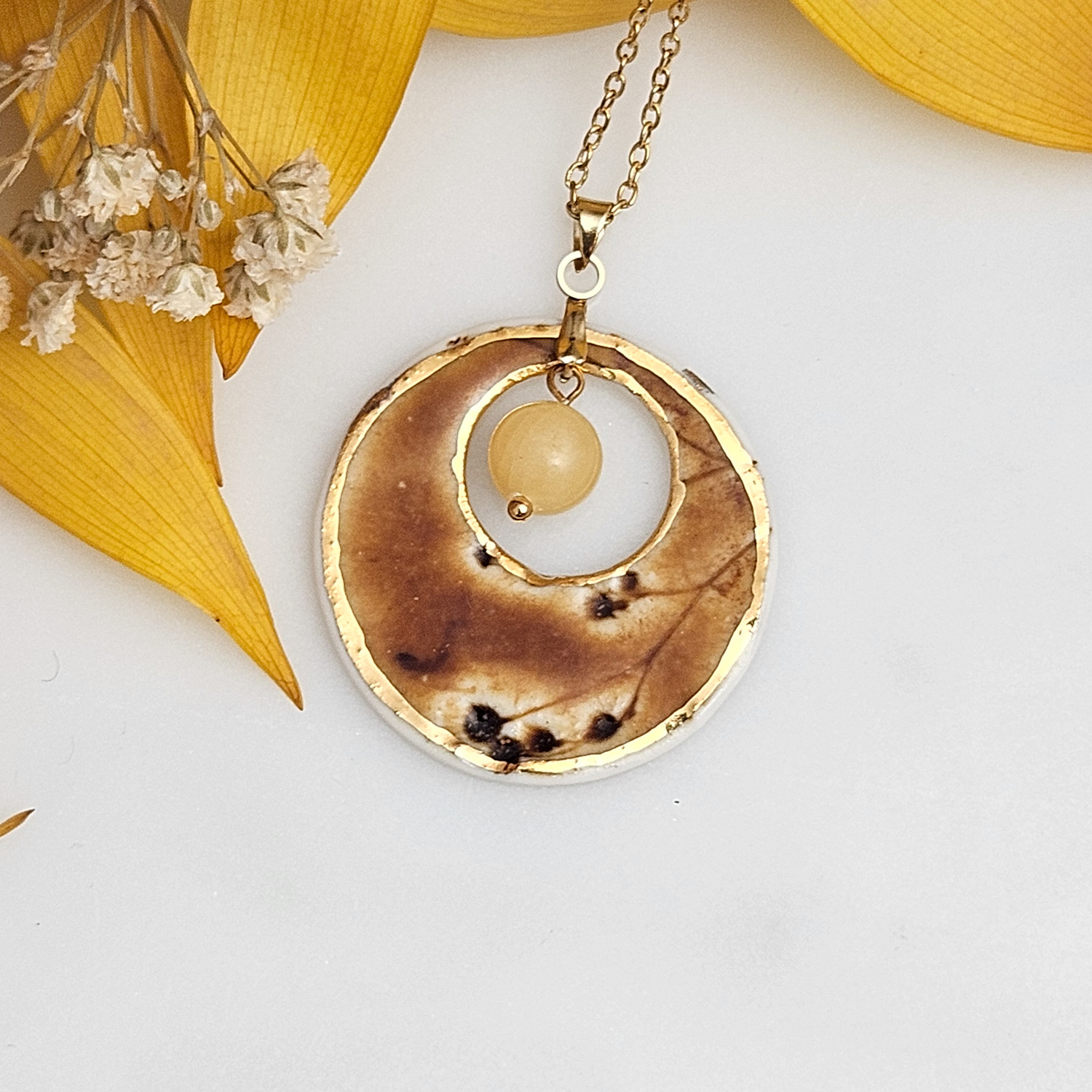 Amber fine ceramic porcelain designer necklace - embossed plant with 22k gold plating and amber nephrite