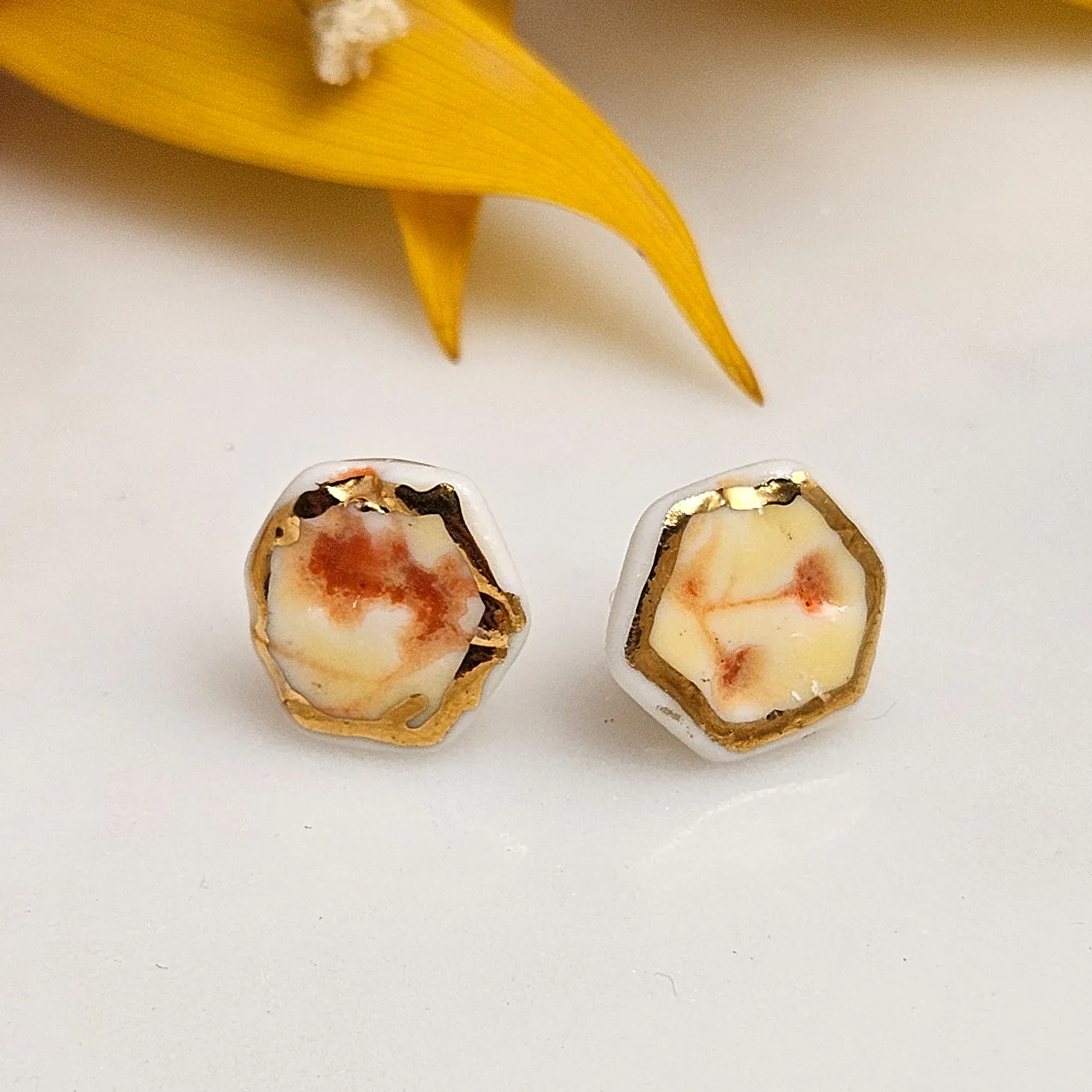 Yellow-red fine ceramic porcelain hypoallergenic stud designer earrings for sensitive ears with 22k gold plating - embossed plant