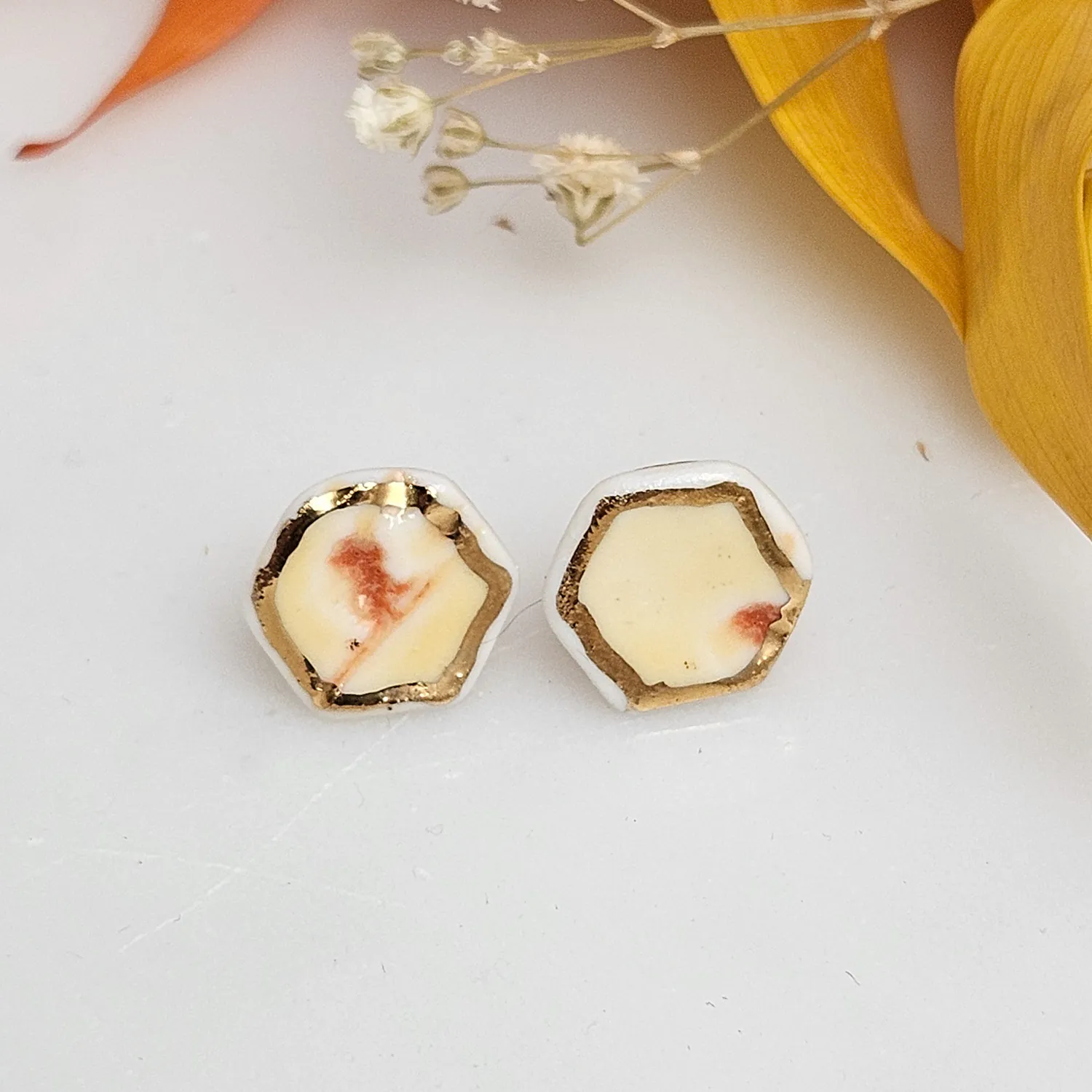 Yellow-red fine ceramic porcelain hypoallergenic stud designer earrings for sensitive ears with 22k gold plating - embossed plant