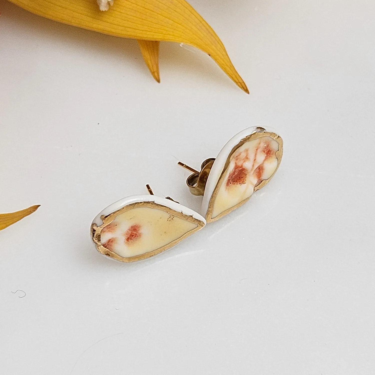 Yellow-red fine ceramic porcelain hypoallergenic stud designer earrings for sensitive ears with 22k gold plating - embossed plant - Image 2