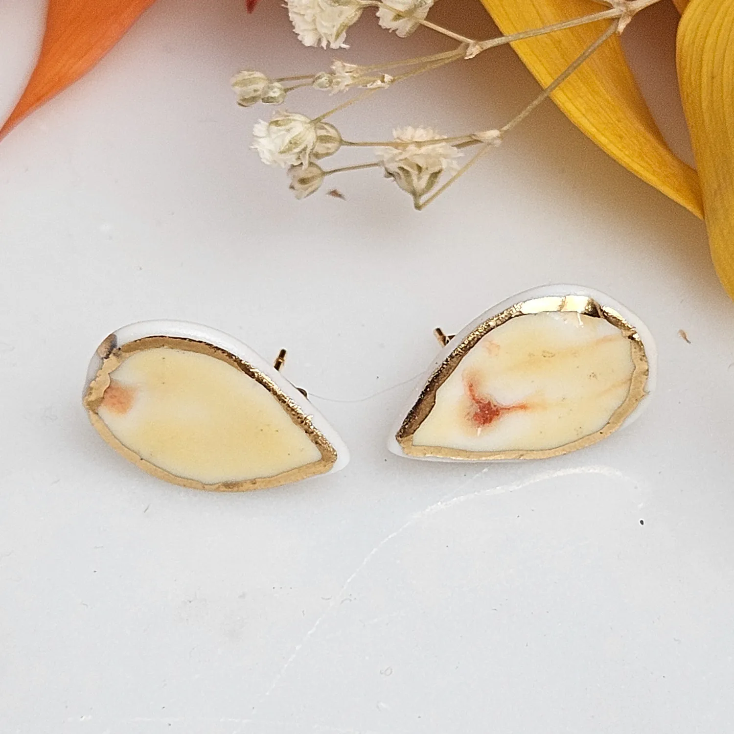 Yellow-red fine ceramic porcelain hypoallergenic stud designer earrings for sensitive ears with 22k gold plating - embossed plant
