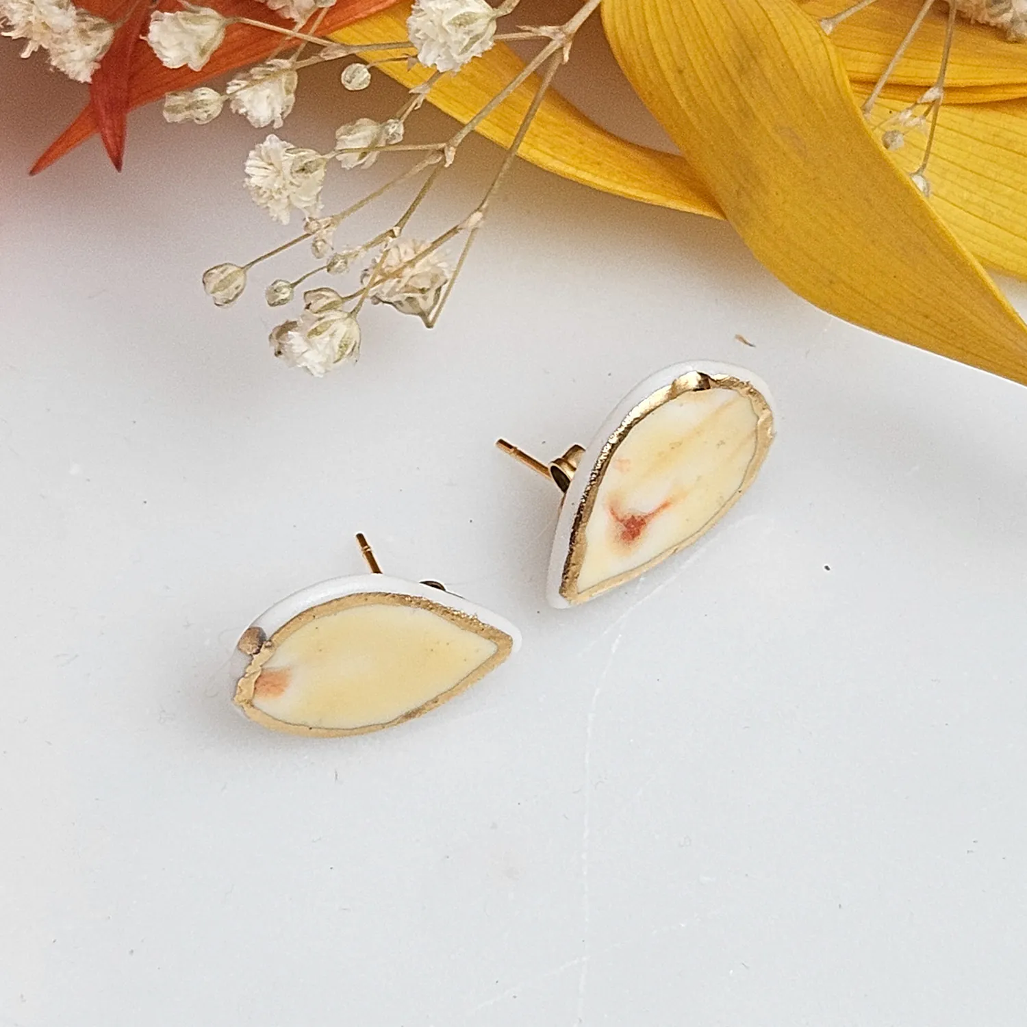 Yellow-red fine ceramic porcelain hypoallergenic stud designer earrings for sensitive ears with 22k gold plating - embossed plant - Image 2
