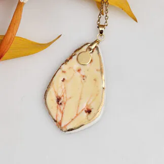 Yellow-red fine ceramic porcelain designer necklace - embossed plant with 22k gold plating and round pendant
