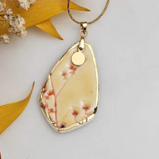 Yellow-red fine ceramic porcelain designer necklace - embossed plant with 22k gold plating and round pendant