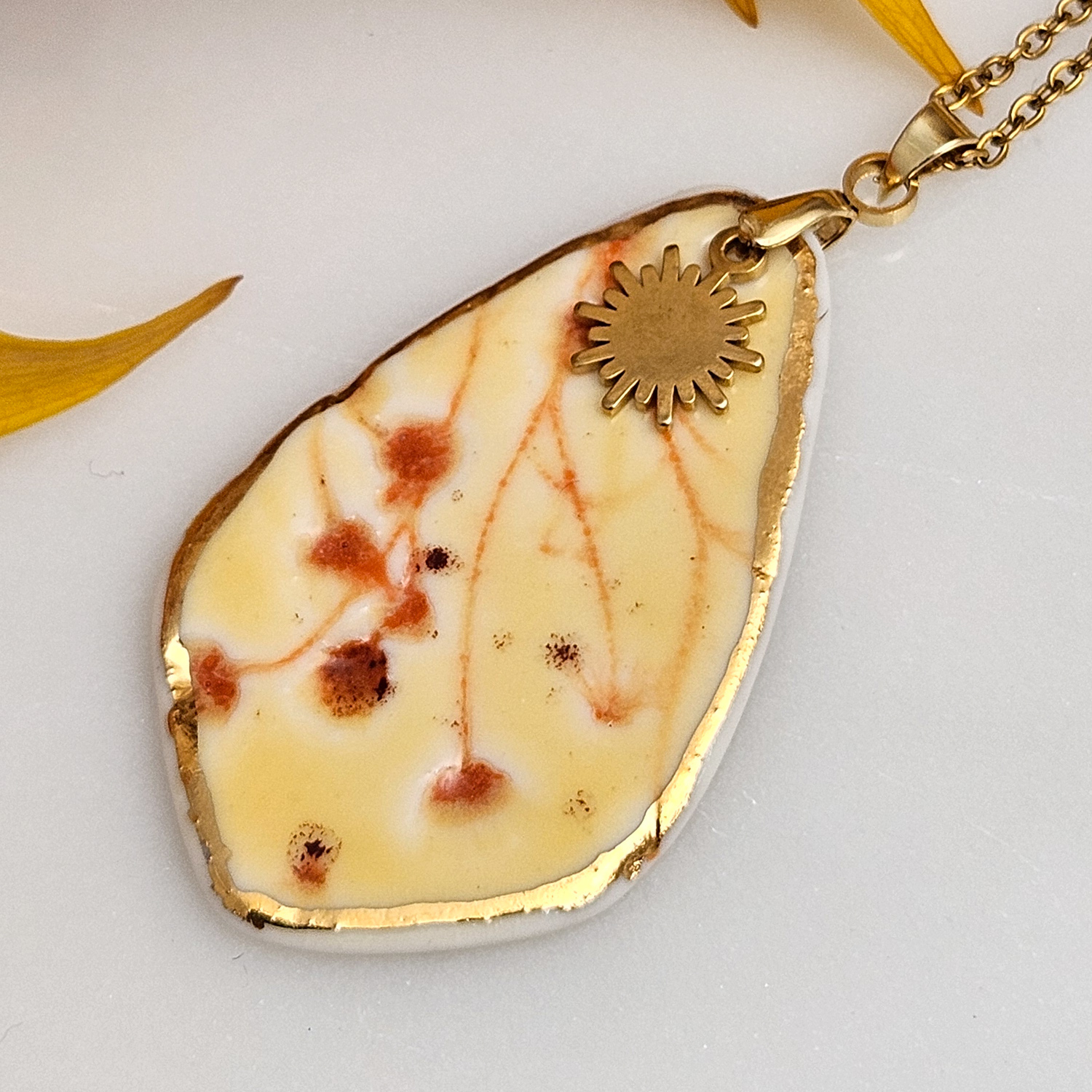 Yellow-red fine ceramic porcelain designer necklace - embossed plant with 22k gold plating and sun pendant - Image 2