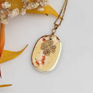 Yellow-red fine ceramic porcelain designer necklace - embossed plant with 22k gold plating and clover pendant