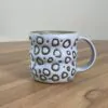 Wavy pastel blue mug, masked pattern
