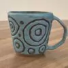 Turqouise mug, masked circles pattern