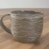 Mug with minty-green glaze and organic carvings (1)