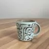 Green mug, masked swirly pattern - Image 2