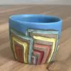 Colorful tumbler with geometric carvings