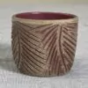 Toffee tumbler with feather-like carvings