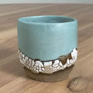 Light teal tumbler with a cloud-like belt