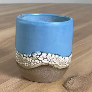 Blue tumbler with a cloud-like belt