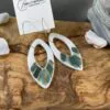 Leaf-shaped openwork earrings with gold stripes - Image 2