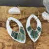 Leaf-shaped openwork earrings with gold stripes
