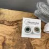 Green inception stick earrings with gold details - Image 3