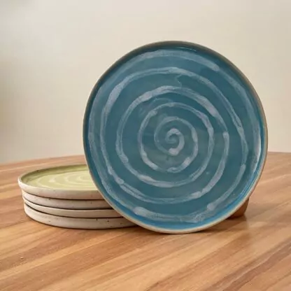 Blue dinner plate with white spiral