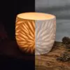 Porcelain luminary with carvings
